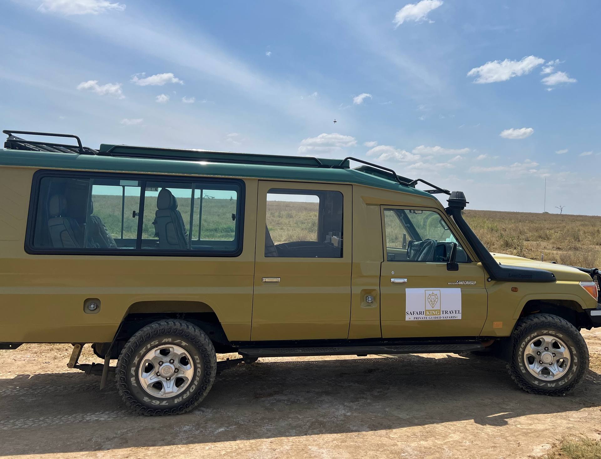 Safari guide at the wheel of a Land Cruiser