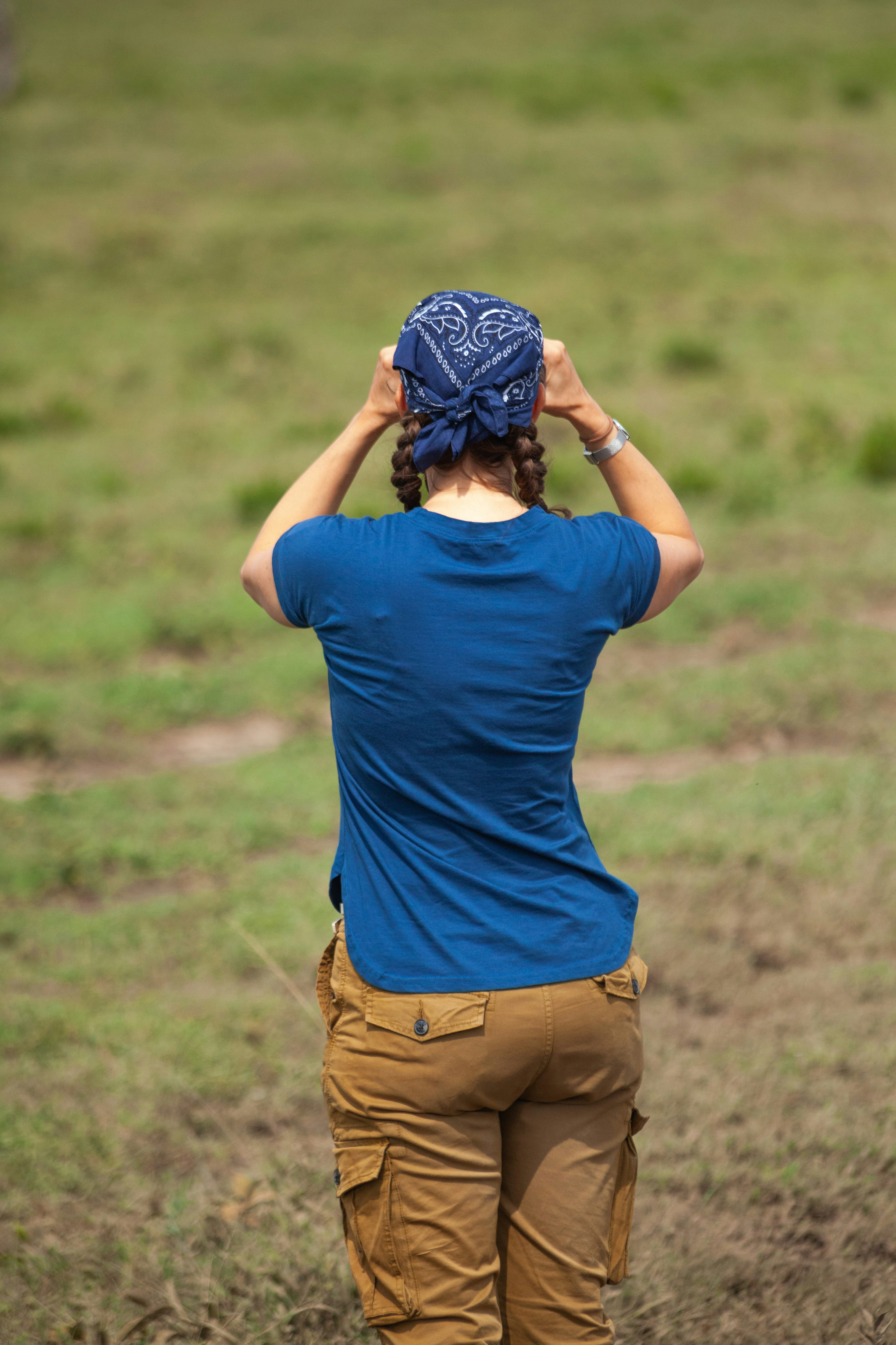 Photographer on safari spotting wildlife
